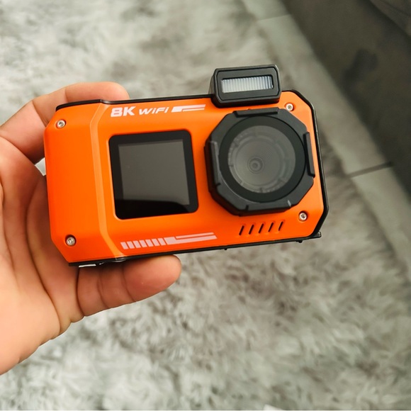 Orange and Black Simulated Camera with Rugged Design